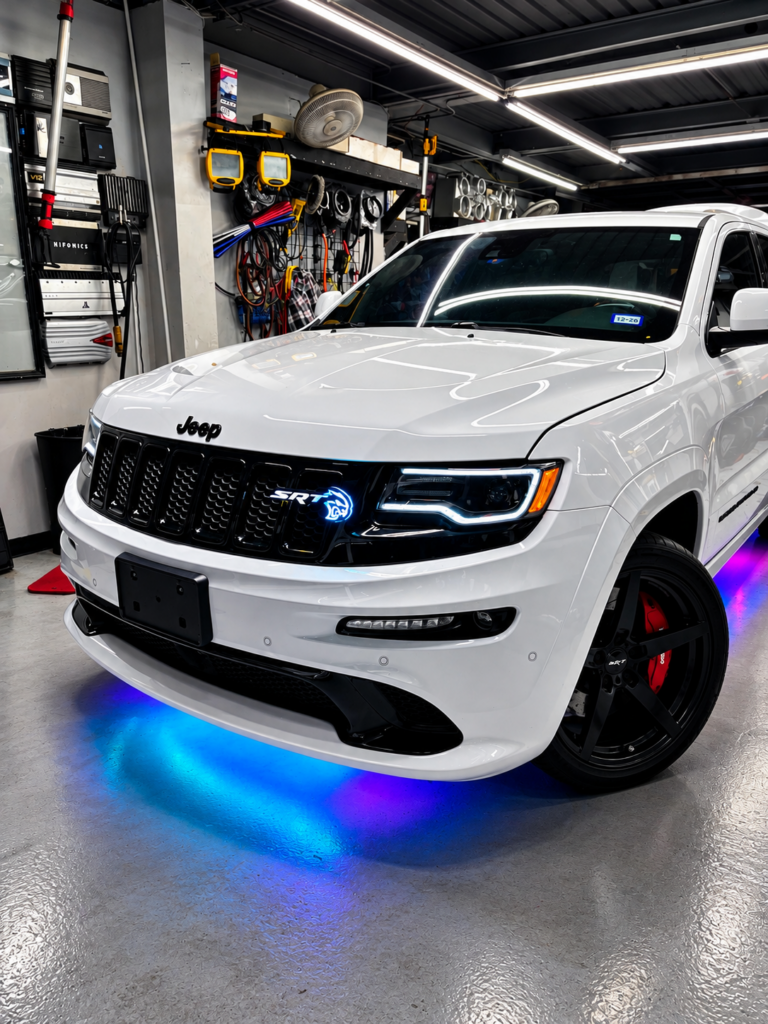 White SUV with blue LED underbody lighting installed at MTC PRO AUDIO